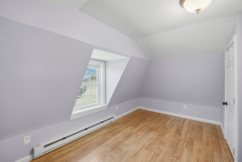 196 Pendleton Avenue Chicopee, MA 01020 - Photo 15 of 22 a view of a room that has wooden floor and window