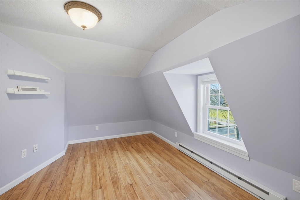 196 Pendleton Avenue Chicopee, MA 01020 - Photo 17 of 22 a view of room with window and wooden floor