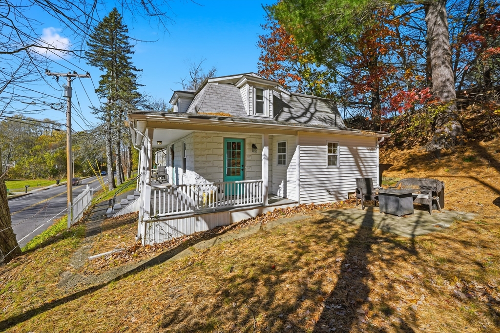 196 Pendleton Avenue Chicopee, MA 01020 - Photo 21 of 22 a view of a house with a large tree and a yard