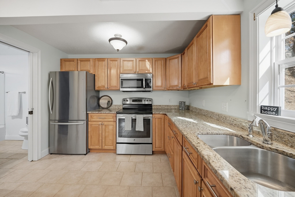 196 Pendleton Avenue Chicopee, MA 01020 - Photo 4 of 22 a kitchen with a sink appliances and cabinets