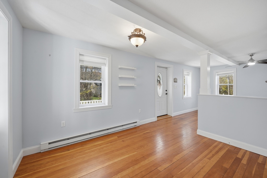196 Pendleton Avenue Chicopee, MA 01020 - Photo 6 of 22 wooden floor in an empty room with a window