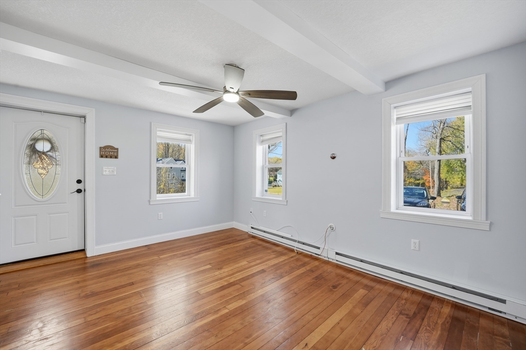 196 Pendleton Avenue Chicopee, MA 01020 - Photo 8 of 22 a view of empty room with wooden floor and fan