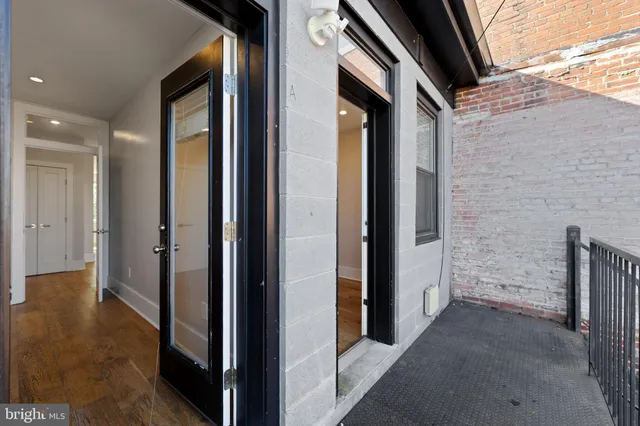 a view of a hallway with washer and dryer