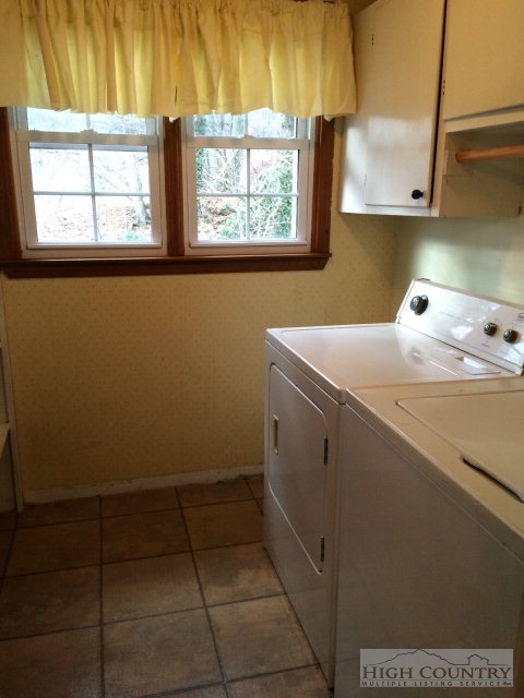 39 Painter Road Banner Elk, NC 28604 - Photo 13 of 17 a utility room with dryer and window