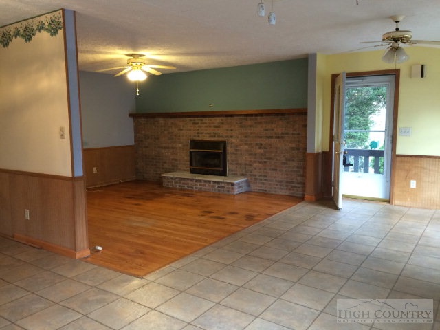39 Painter Road Banner Elk, NC 28604 - Photo 14 of 17 a view of a livingroom with a fireplace and a chandelier