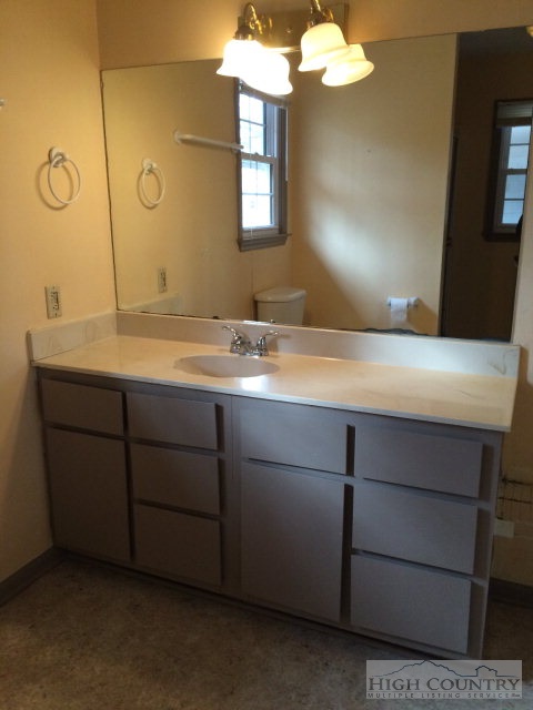 39 Painter Road Banner Elk, NC 28604 - Photo 3 of 17 a bathroom with a sink vanity and mirror