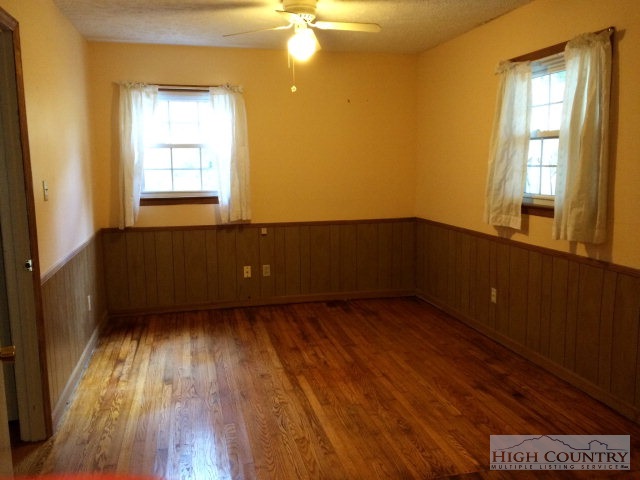 39 Painter Road Banner Elk, NC 28604 - Photo 6 of 17 a view of an empty room with wooden floor and a window