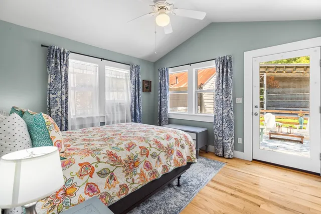 a bedroom with a bed and window