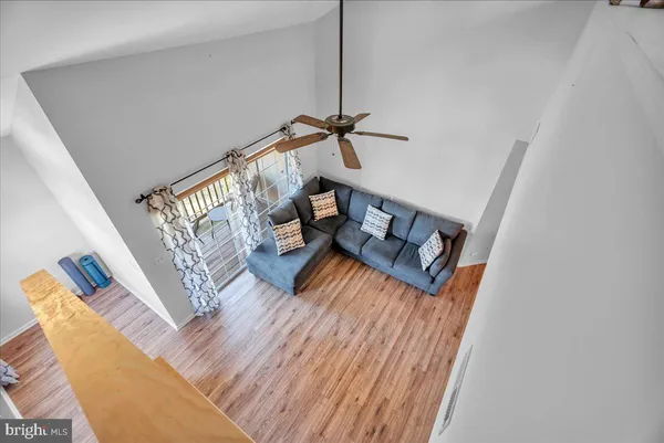 a view of a living room and wooden floor