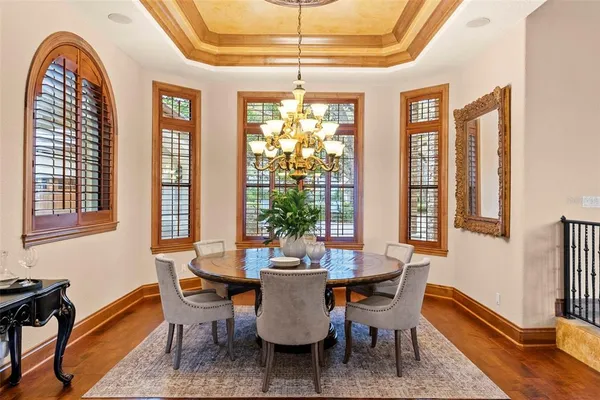 a room with furniture pool table and outdoor view