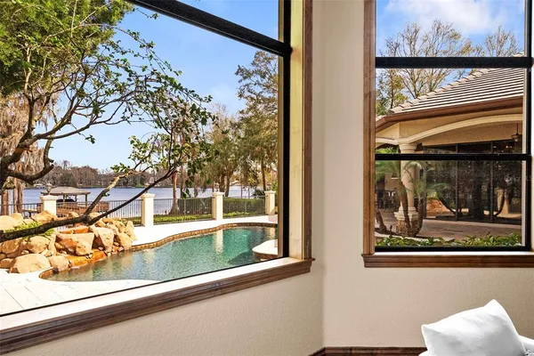 a view of a dining room with furniture window and outside view