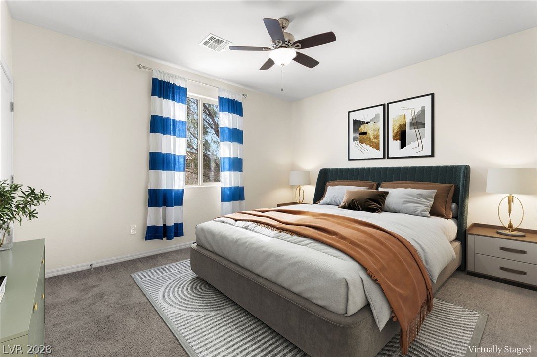 11048 Prairie Grove Road Las Vegas, NV 89179 - Photo 50 of 75 A well-lit bedroom featuring a comfortable bed and contemporary decor.