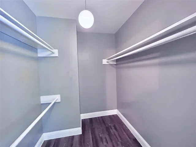 a view of room with wooden floor