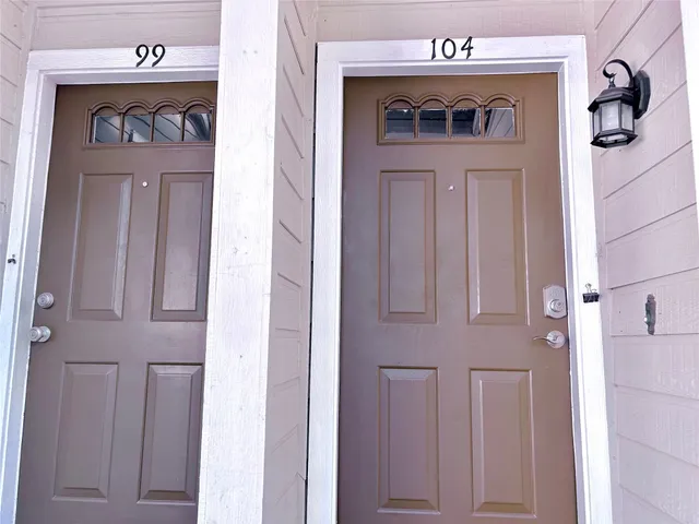 a kitchen with a stove and refrigerator