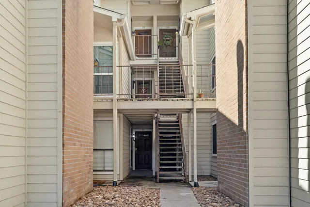 a view of a house with a door and a window