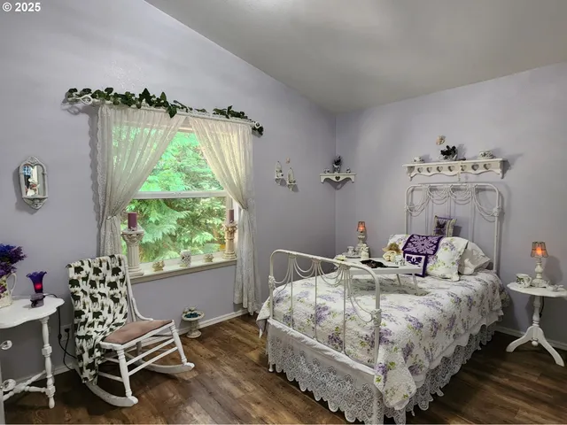 a bedroom with bed and a window