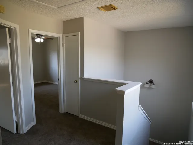 a bathroom with a toilet and a bath tub