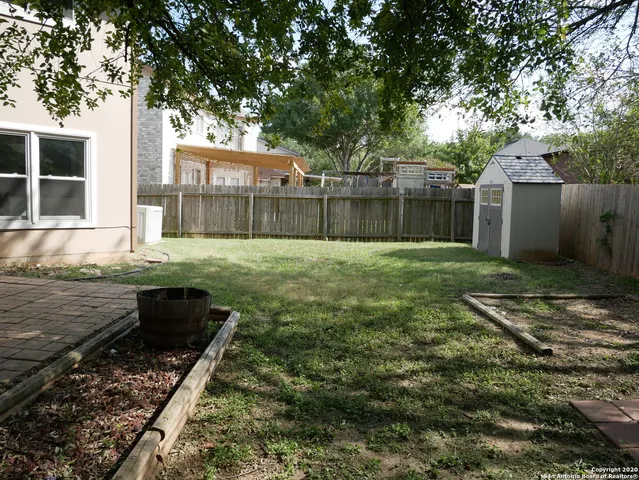 a view of swimming pool with a patio