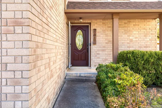 a view of entryway with brick walls