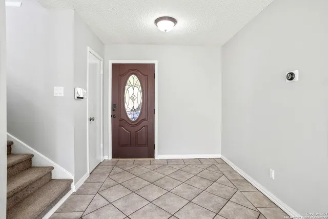 a view of a hallway with entryway