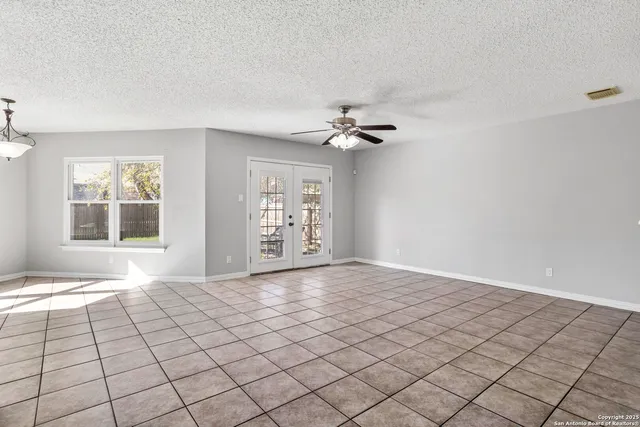 a view of an empty room and window