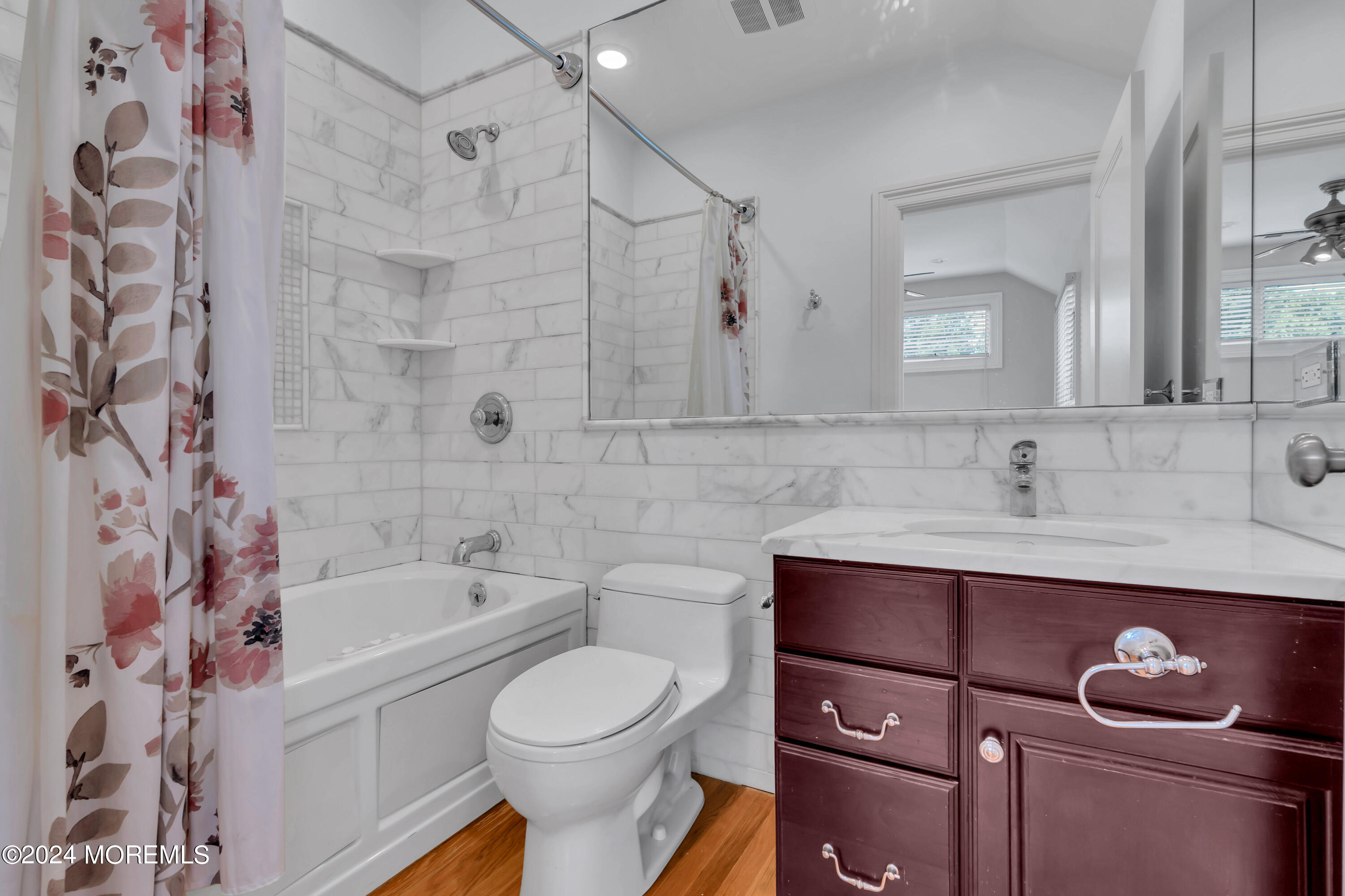95 River Road Rumson, NJ 07760 - Photo 14 of 19 a bathroom with a sink a toilet and shower