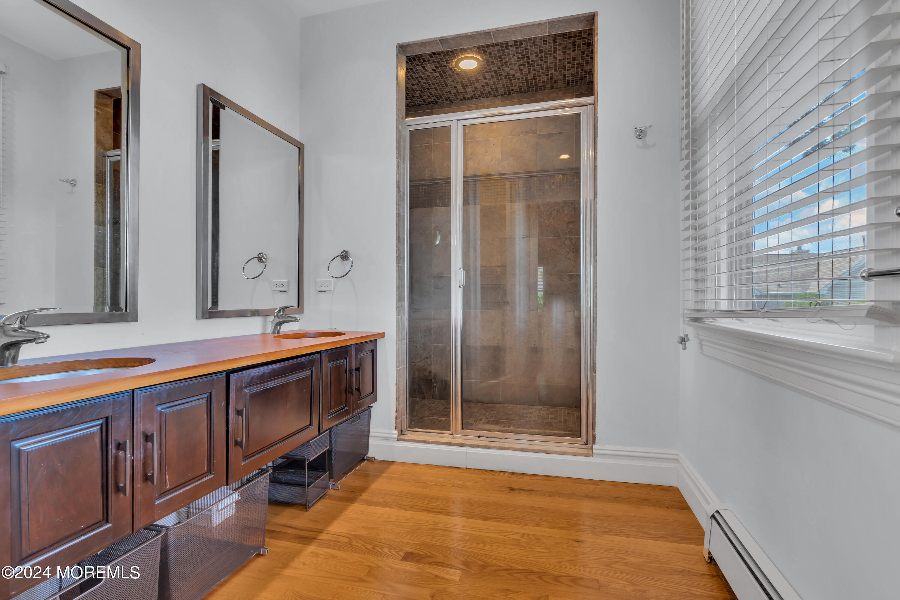 95 River Road Rumson, NJ 07760 - Photo 15 of 19 a spacious bathroom with a mirror and a shower