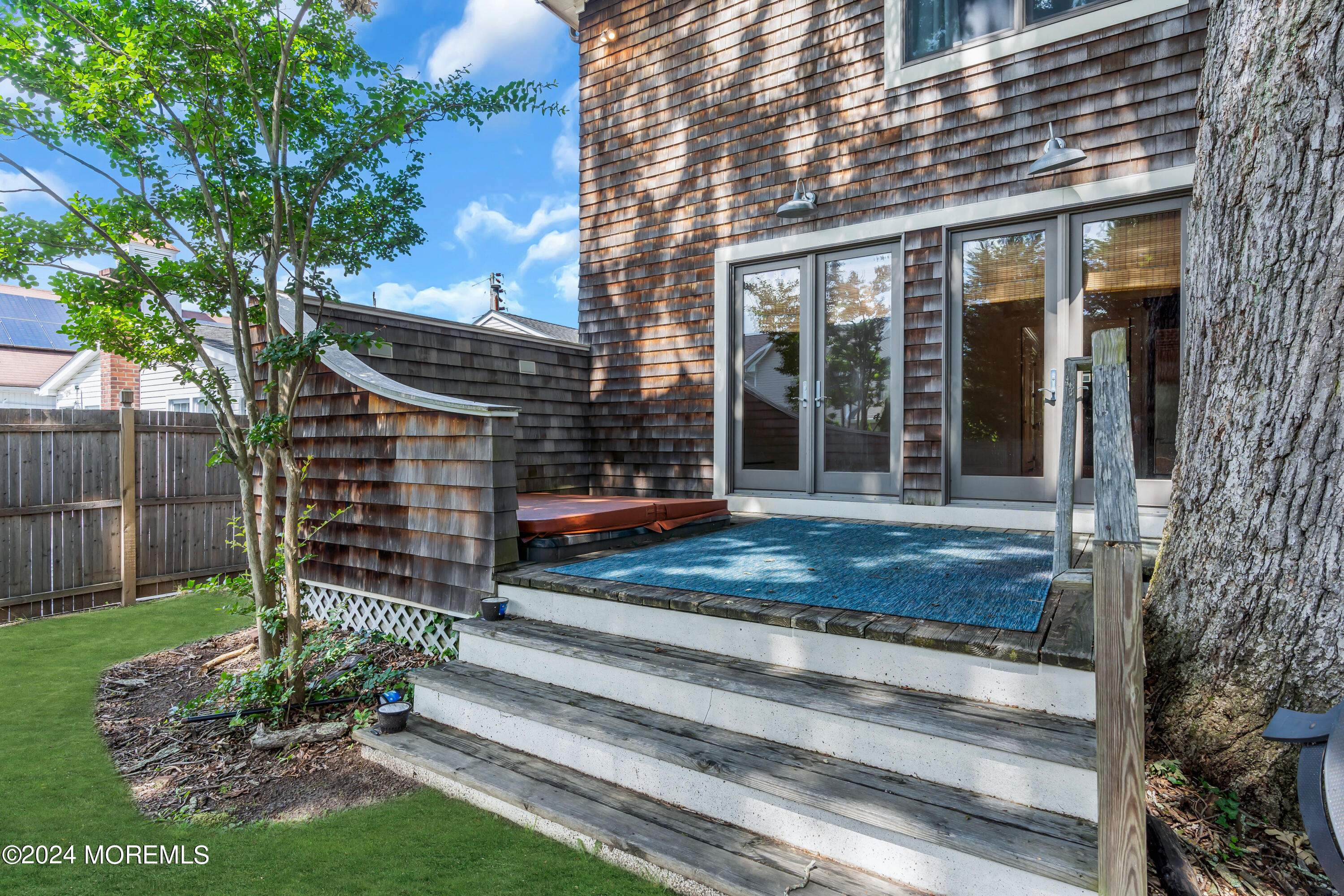 95 River Road Rumson, NJ 07760 - Photo 16 of 19 a front view of a house with a garden