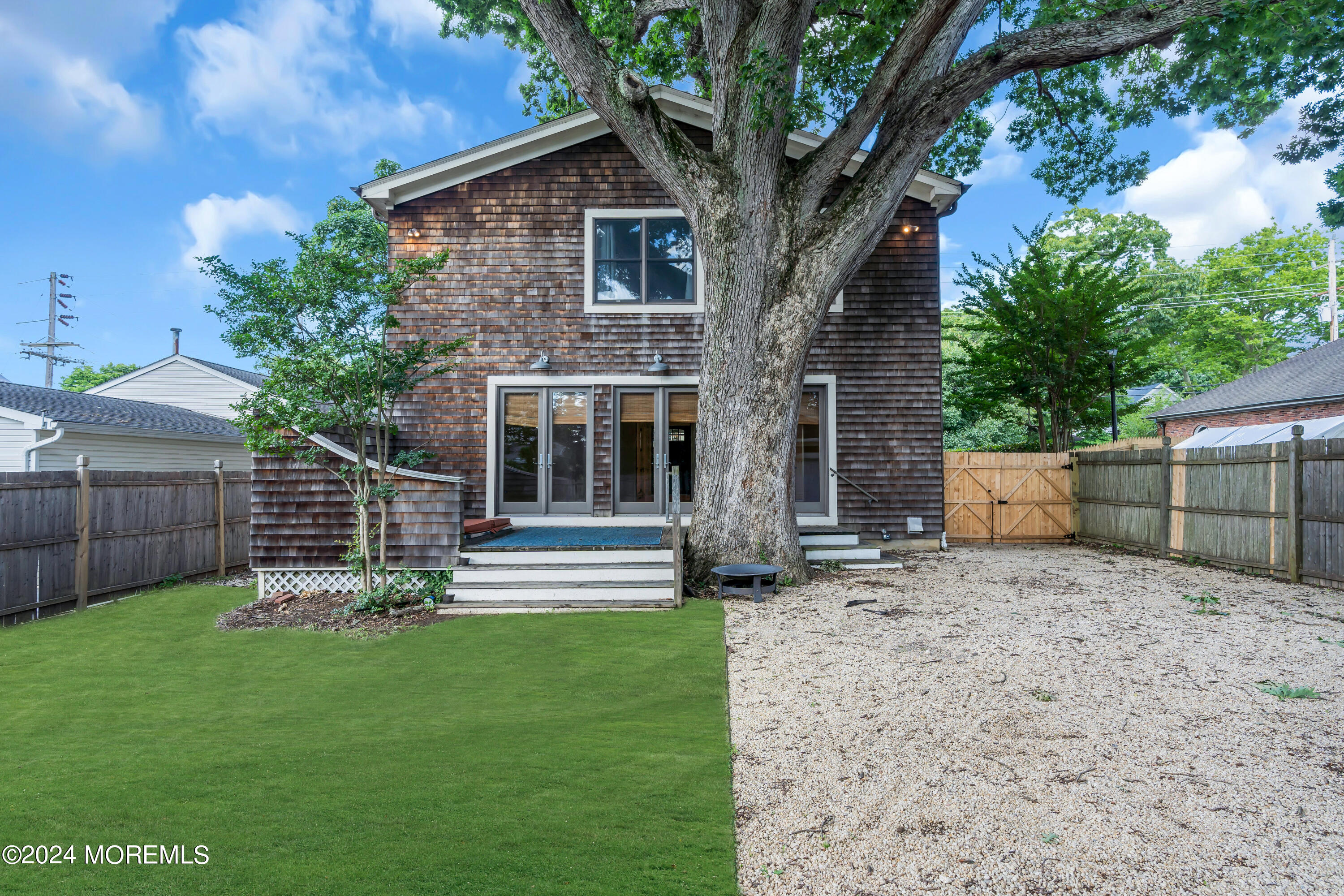 95 River Road Rumson, NJ 07760 - Photo 17 of 19 a front view of a house with a yard
