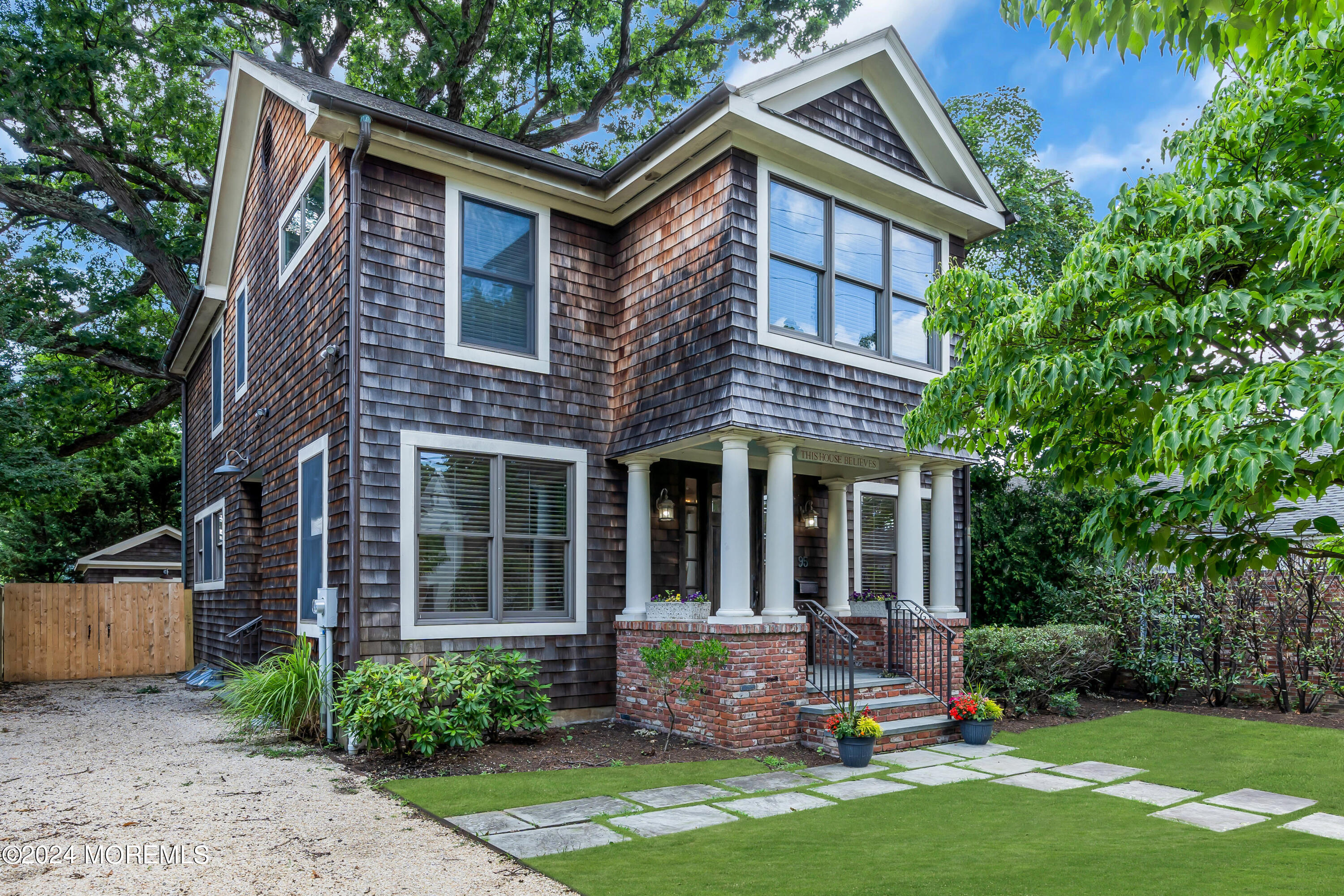 95 River Road Rumson, NJ 07760 - Photo 2 of 19 front view of a house with a yard