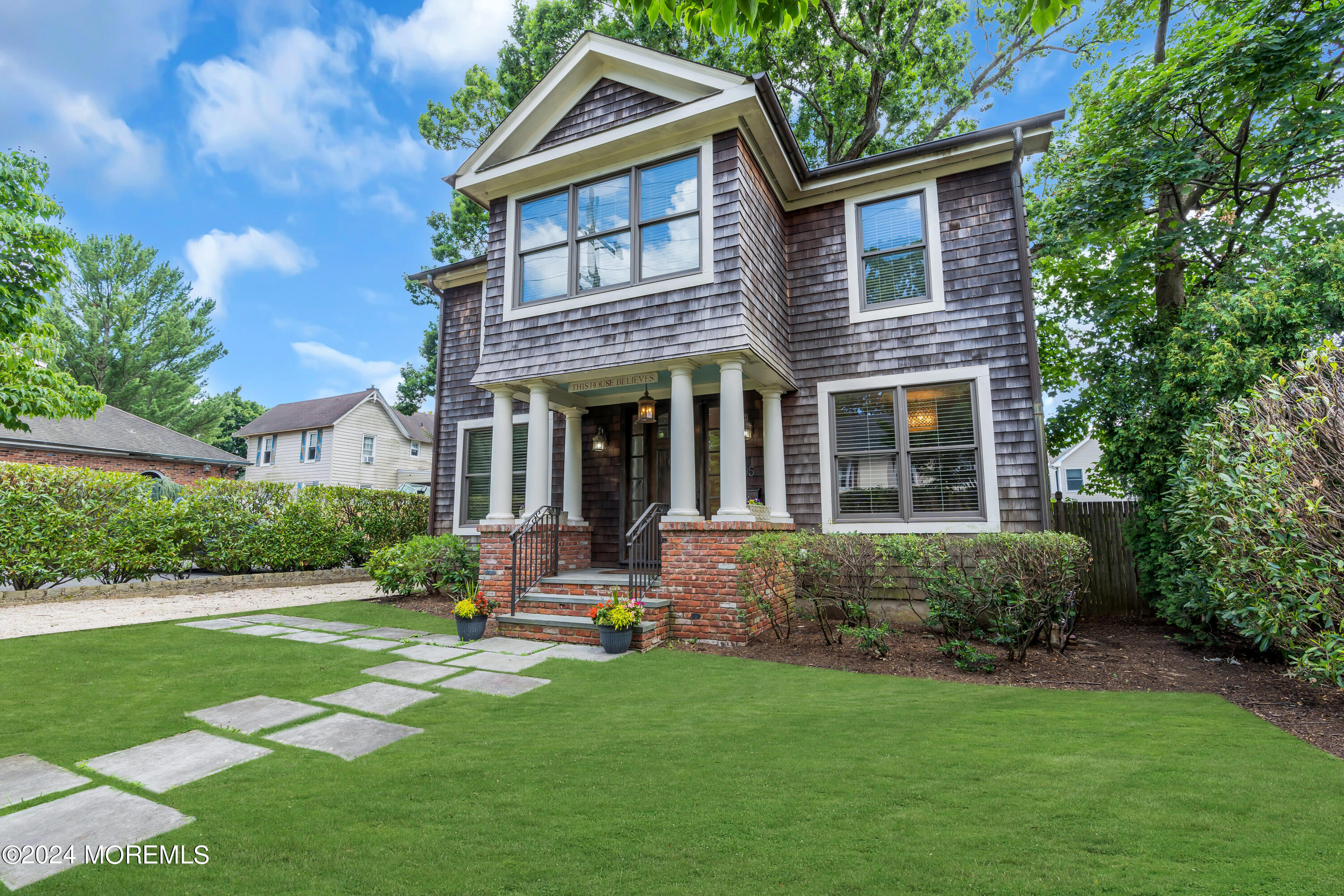 95 River Road Rumson, NJ 07760 - Photo 3 of 19 a front view of a house with a yard