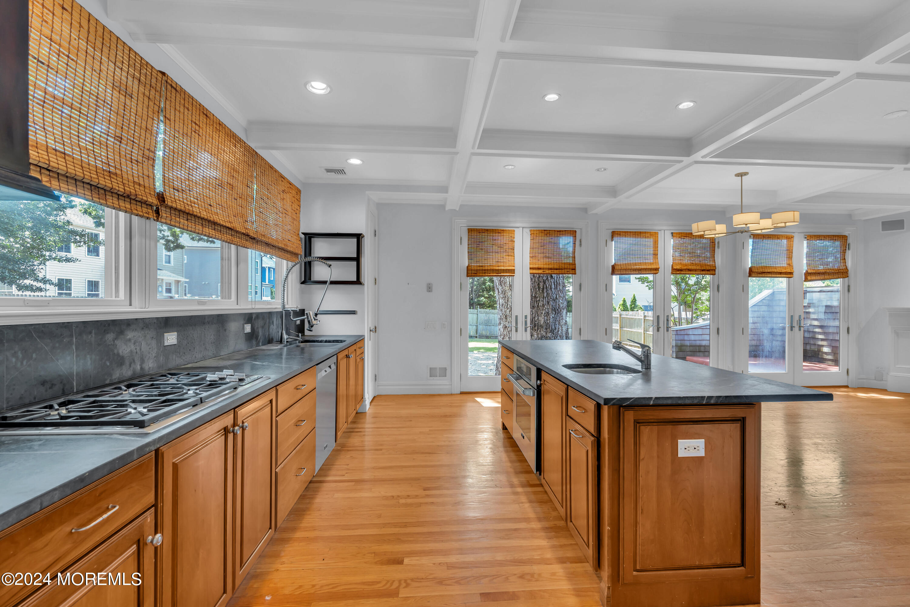 95 River Road Rumson, NJ 07760 - Photo 7 of 19 a kitchen with stainless steel appliances granite countertop a stove and a wooden cabinets