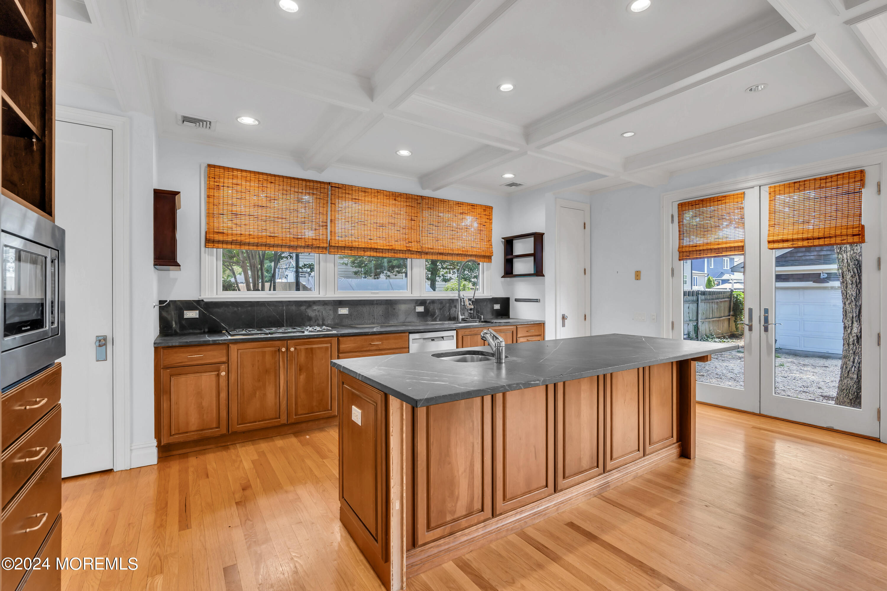 95 River Road Rumson, NJ 07760 - Photo 8 of 19 a kitchen with stainless steel appliances granite countertop a sink and a wooden floors