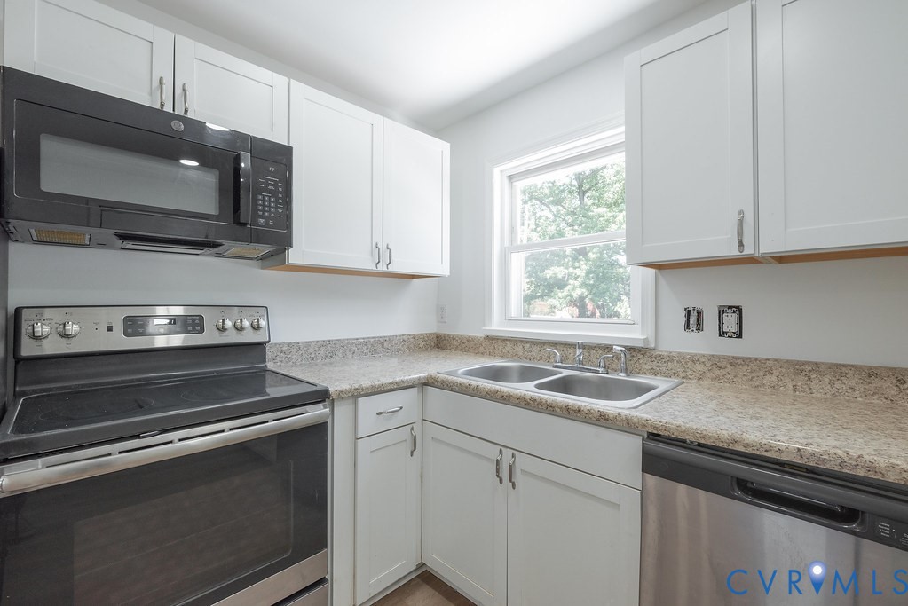 3400 Ryburn Road Richmond, VA 23234 - Photo 18 of 45 Kitchen featuring white shaker-style cabinetry, a