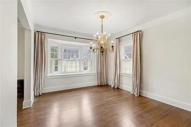 a view of livingroom with window wooden floor and front door
