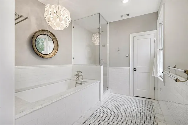 a bathroom with a sink a mirror and a shower