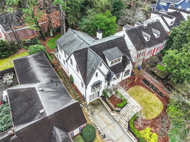 an aerial view of a house with outdoor space