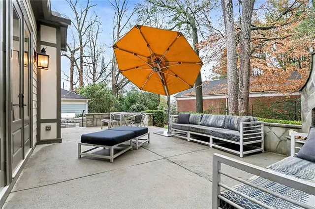 a view of patio with a table chairs and a potted plant