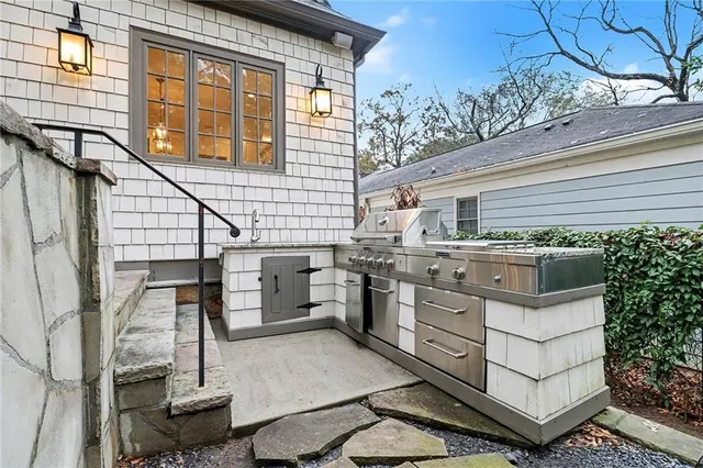 a view of a kitchen with a sink and cabinets