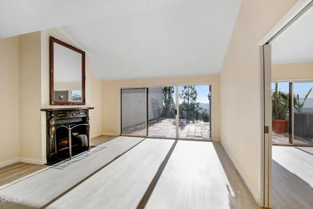 a bedroom with a bed and a balcony view