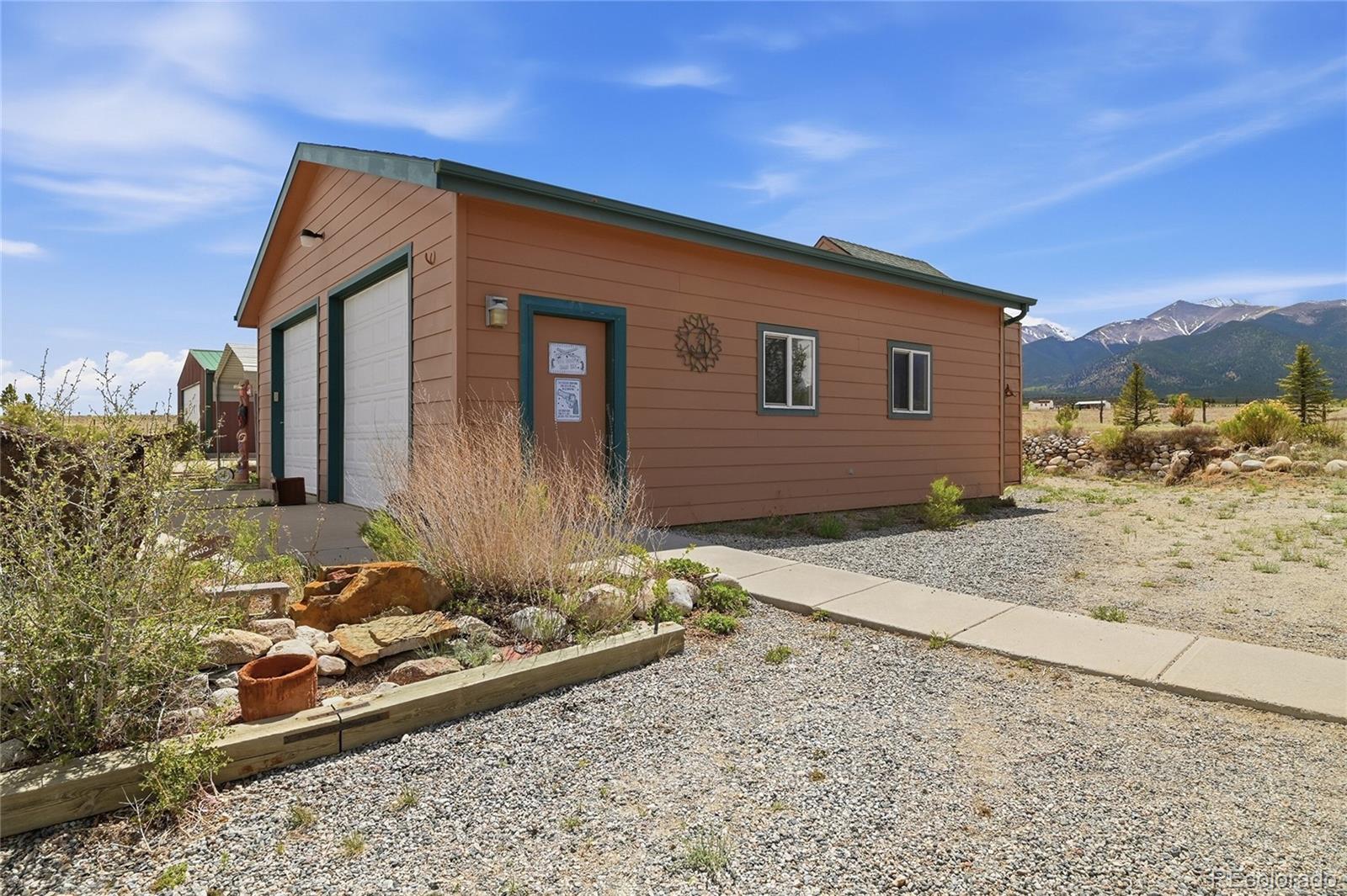 20300 Old Ranch Loop Nathrop, CO 81236 - Photo 28 of 35 a front view of a house with a yard