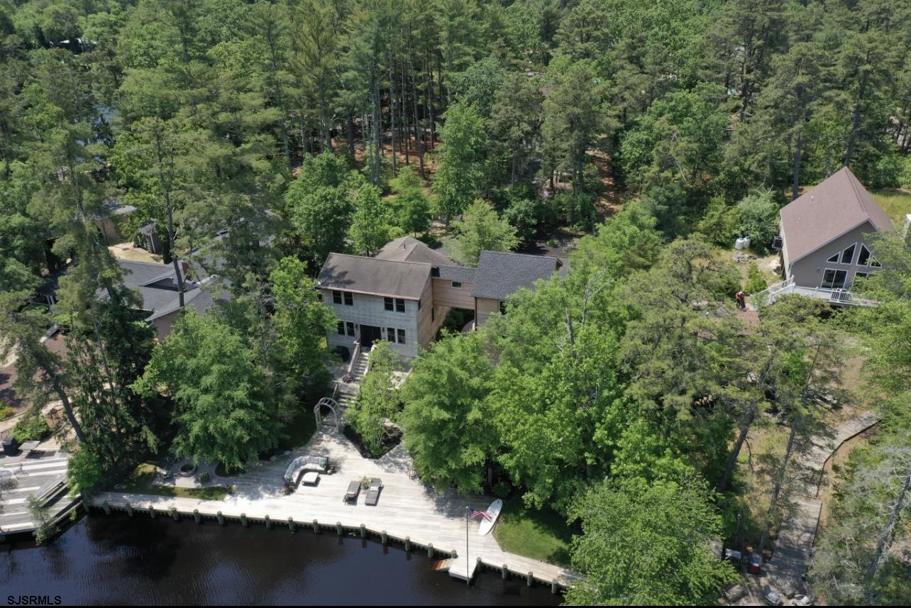 4646 Riverside Drive Sweetwater, NJ 08037 - Photo 11 of 55 an aerial view of a house with yard outdoor seating and trees