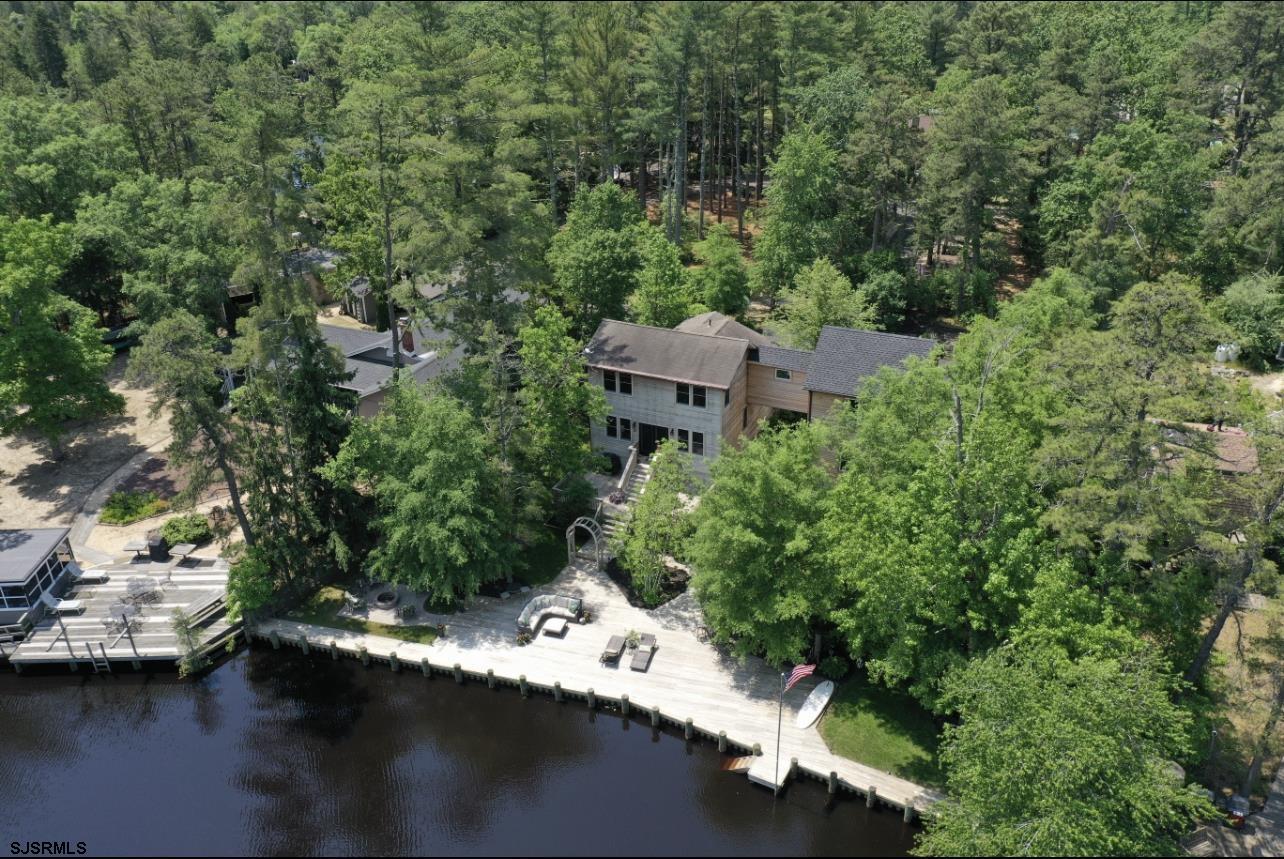 4646 Riverside Drive Sweetwater, NJ 08037 - Photo 12 of 55 an aerial view of a house with a yard lake and mountain view