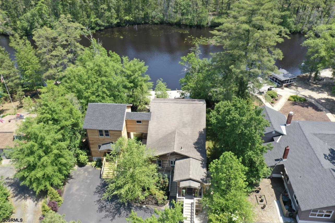 4646 Riverside Drive Sweetwater, NJ 08037 - Photo 19 of 55 an aerial view of a house with a yard and a garden