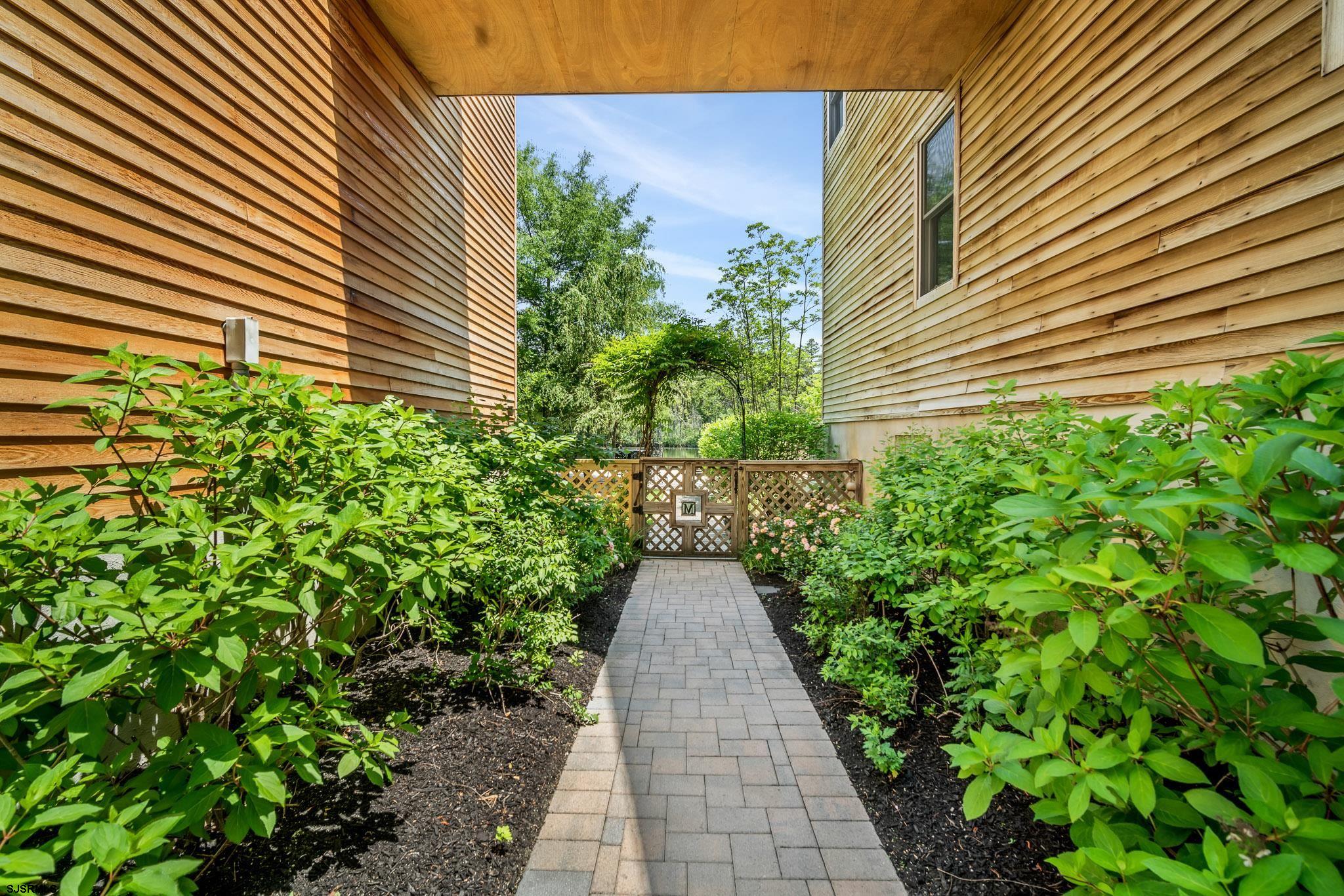 4646 Riverside Drive Sweetwater, NJ 08037 - Photo 24 of 55 a view of a pathway with a pathway both side of house