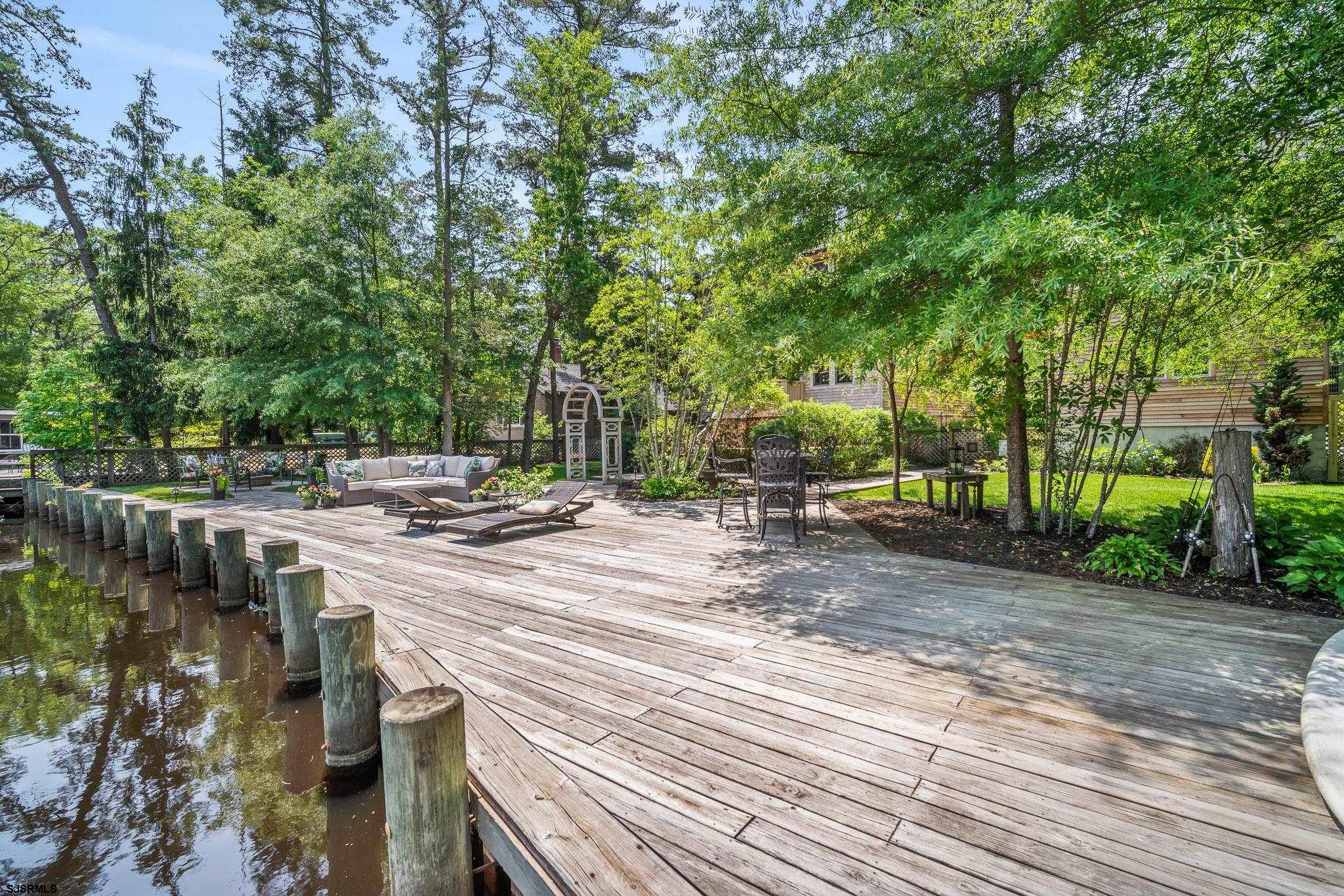 4646 Riverside Drive Sweetwater, NJ 08037 - Photo 26 of 55 a view of a house with backyard and sitting area