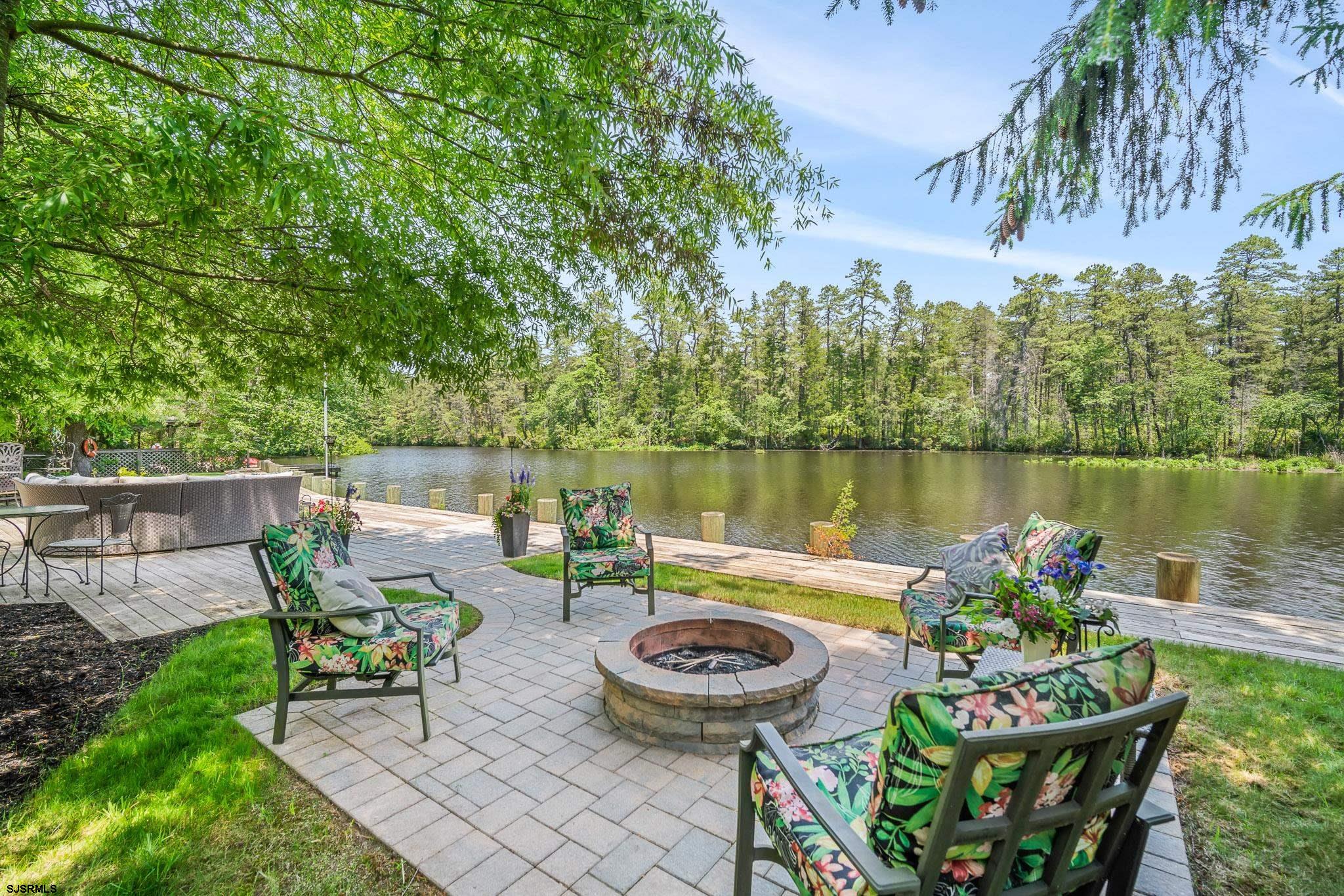 4646 Riverside Drive Sweetwater, NJ 08037 - Photo 29 of 55 a view of a lake with furniture and garden