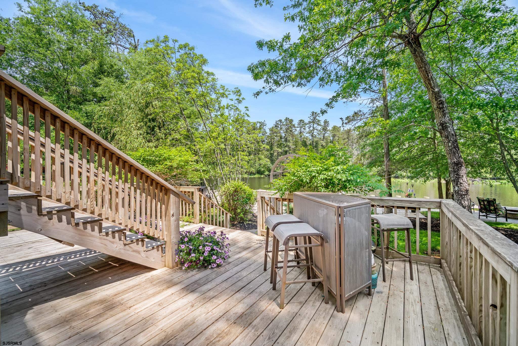 4646 Riverside Drive Sweetwater, NJ 08037 - Photo 31 of 55 a view of deck with furniture and trees