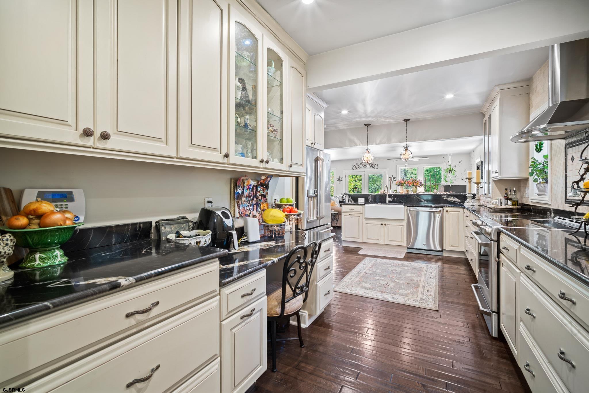4646 Riverside Drive Sweetwater, NJ 08037 - Photo 35 of 55 a kitchen with stainless steel appliances granite countertop a sink and cabinets
