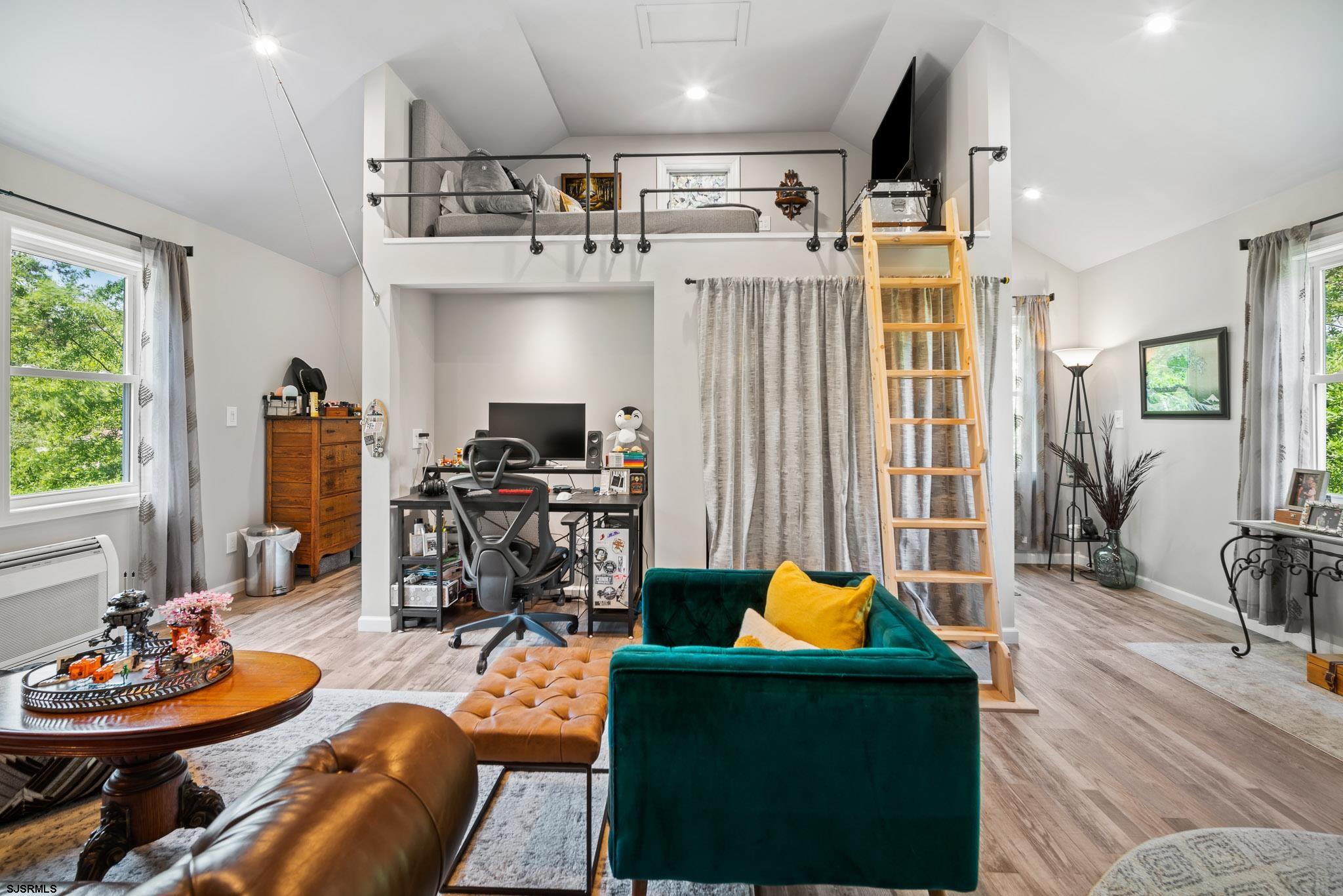 4646 Riverside Drive Sweetwater, NJ 08037 - Photo 47 of 55 a living room with furniture and a flat screen tv
